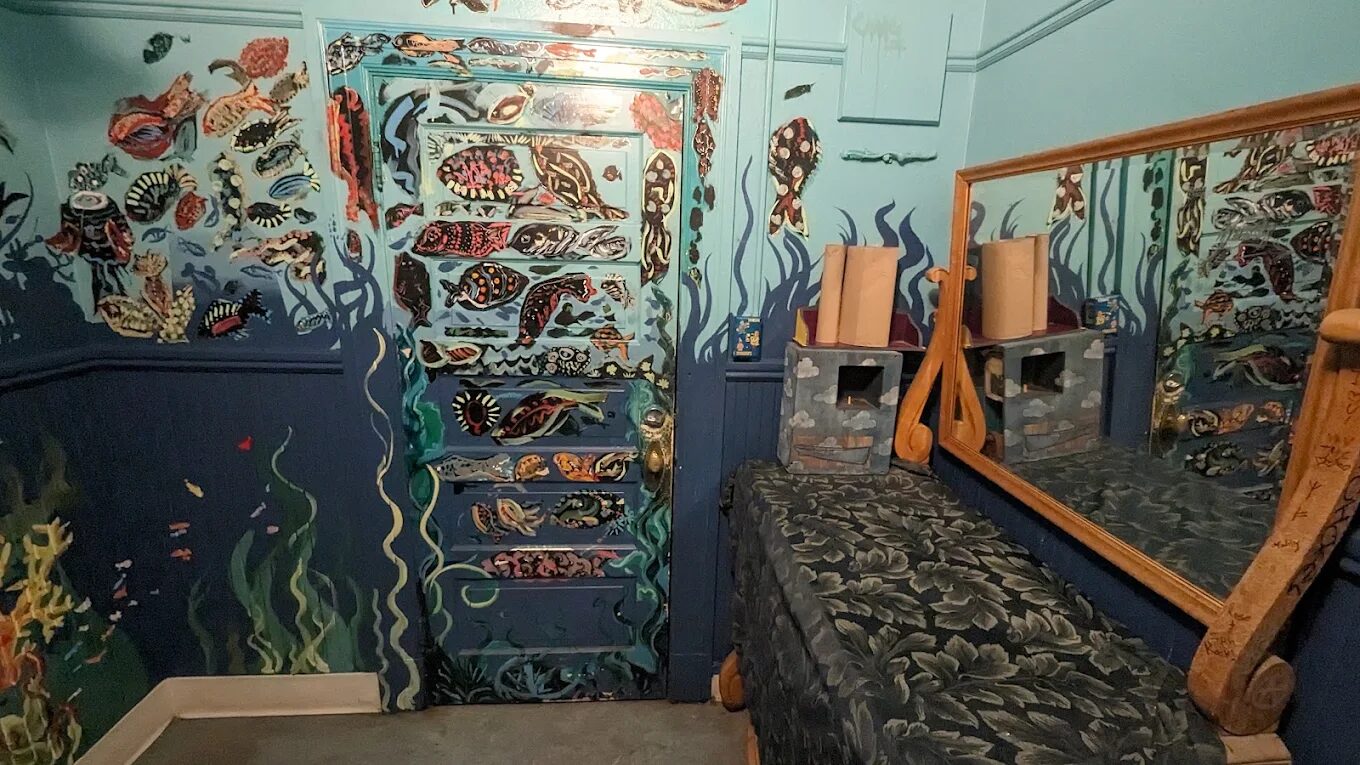 Hand-painted underwater mural along a hallway inside Rimsky-Korsakoffee House