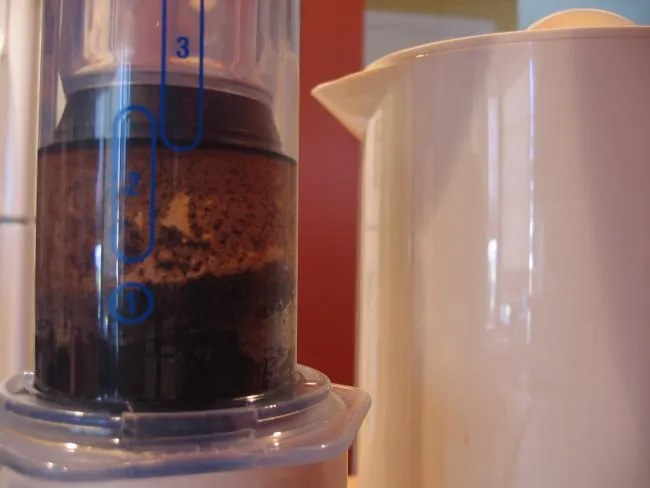 Pressing the AeroPress plunger
