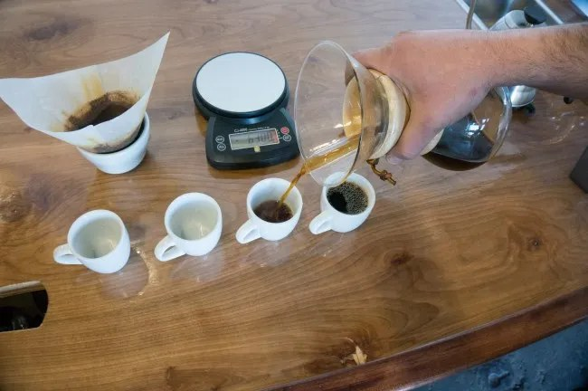 Pouring water over Chemex grounds